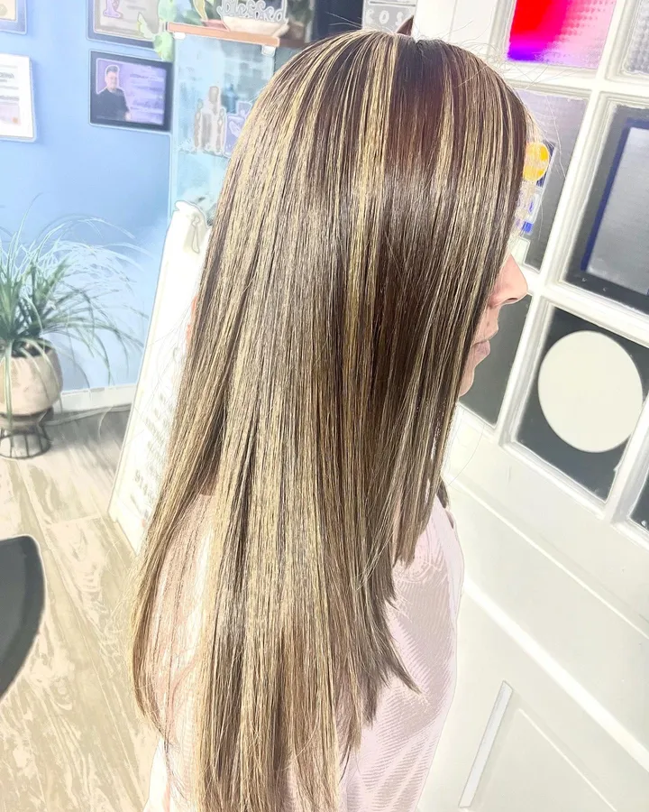 Long straight hair with bold blonde and red highlights