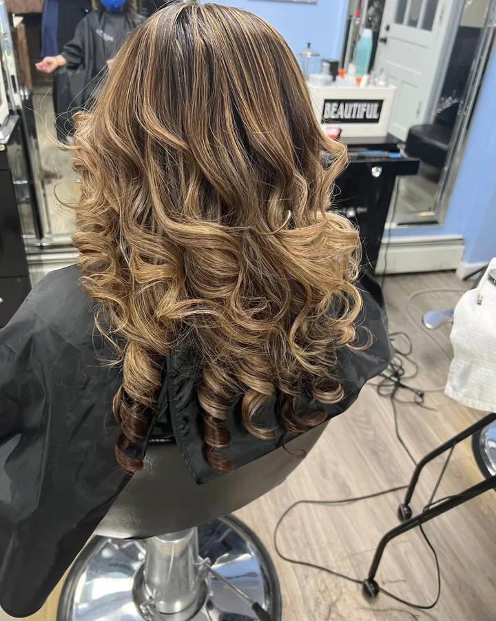 Brown balayage set in big, bouncy curls
